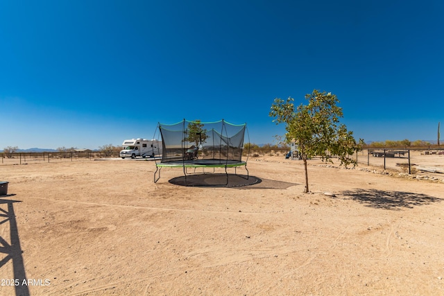 20750 E Chase Ct, Florence, AZ 85132 - view of yard featuring a trampoline and a view of countryside