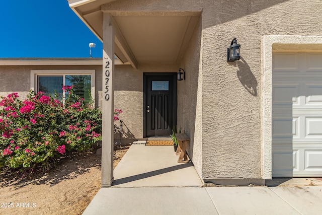 20750 E Chase Ct, Florence, AZ 85132 - doorway to property featuring stucco siding