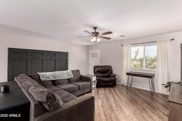 20750 E Chase Ct, Florence, AZ 85132 - living area featuring light wood-style flooring and ceiling fan