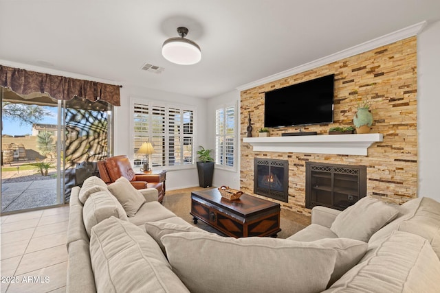 living room featuring a fireplace, light tile patterned flooring, and ornamental molding