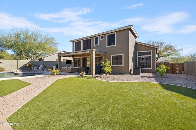 rear view of house featuring a lawn, a fenced in pool, an outdoor hangout area, and central air condition unit