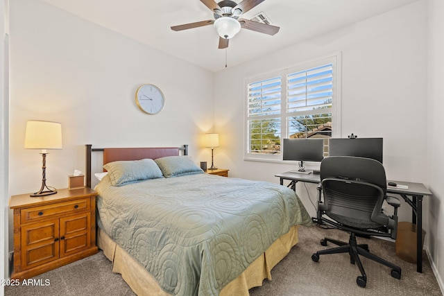 bedroom with ceiling fan and light carpet