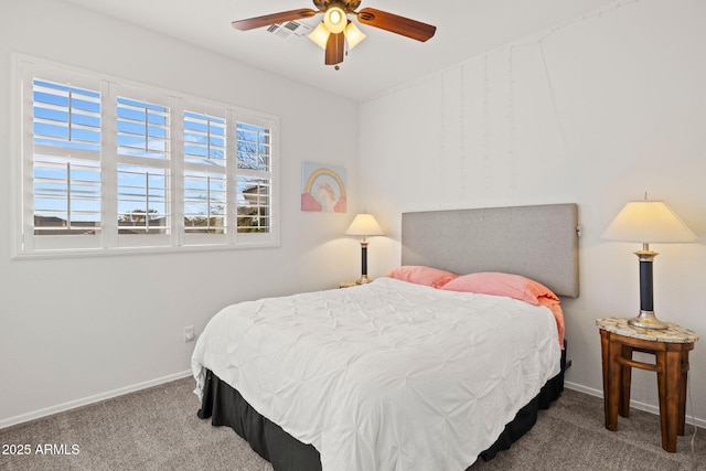 bedroom featuring ceiling fan and carpet