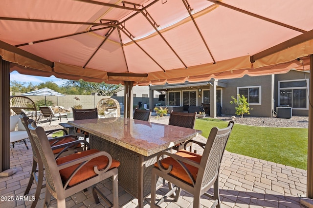 view of patio featuring exterior bar and central AC unit