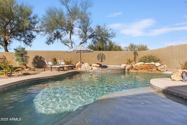 view of swimming pool featuring an in ground hot tub