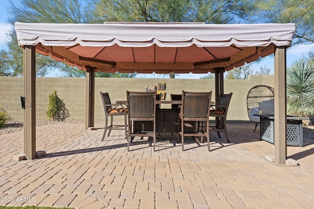 view of patio / terrace with a gazebo and an outdoor bar