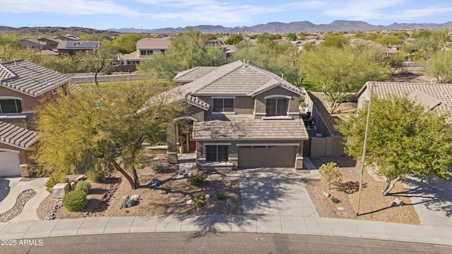 birds eye view of property with a mountain view