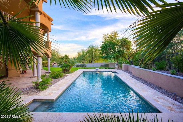 view of swimming pool featuring a patio