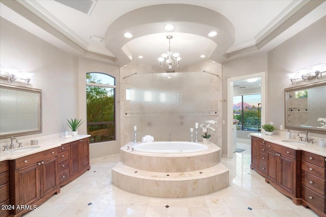 bathroom with crown molding, vanity, a chandelier, and shower with separate bathtub