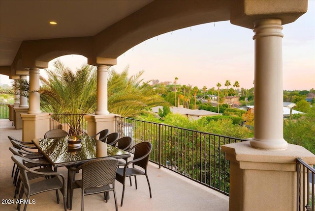 view of balcony at dusk