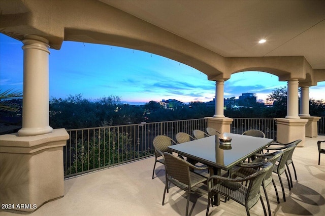 patio terrace at dusk with a balcony