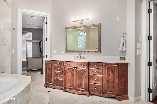 bathroom with vanity and tiled bath