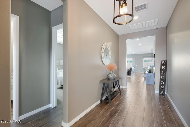 hall with dark wood-type flooring