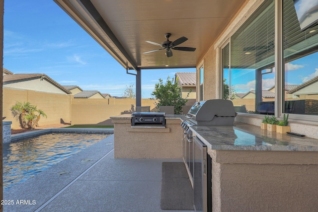 view of patio / terrace featuring ceiling fan, an outdoor kitchen, and area for grilling