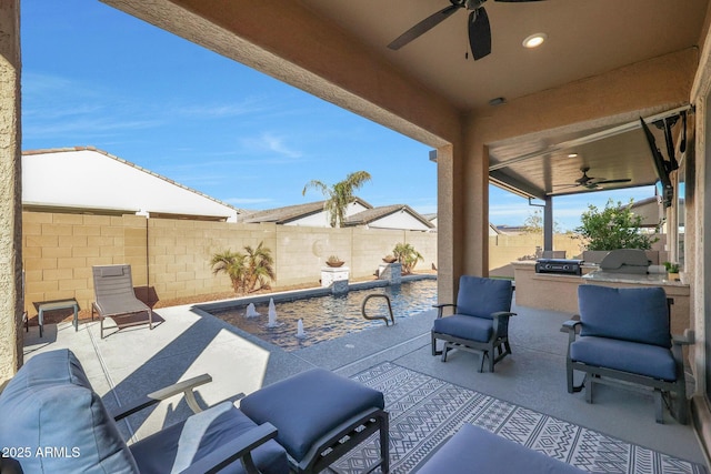 view of patio with ceiling fan and exterior kitchen