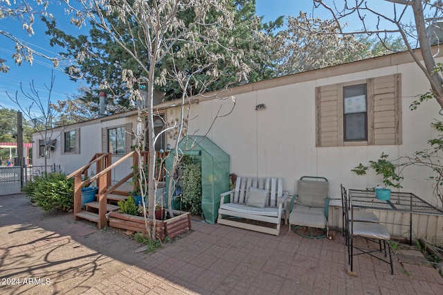 view of front of home featuring a patio