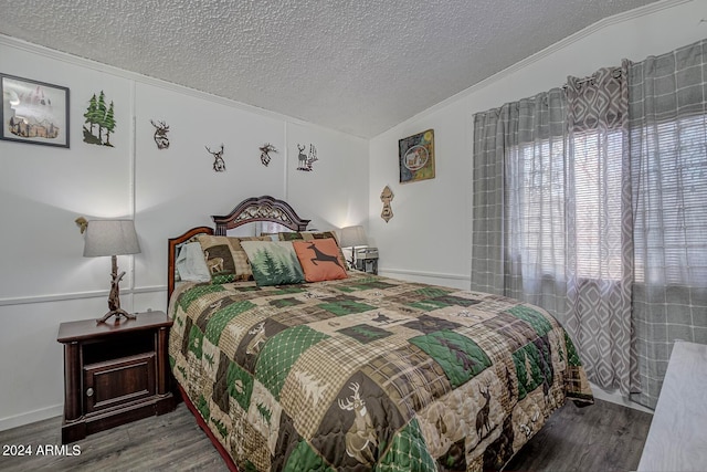 bedroom featuring dark hardwood / wood-style floors, vaulted ceiling, crown molding, and a textured ceiling