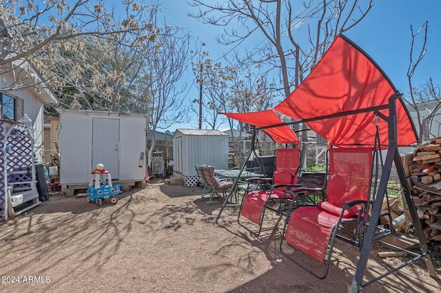 view of patio / terrace with a storage unit