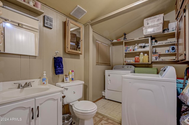 laundry room featuring sink, light tile floors, and washer and dryer