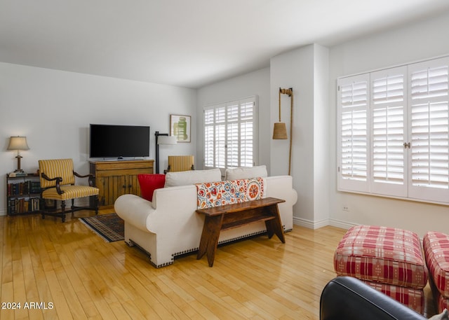 2201 N Central Ave Unit 4E, Phoenix, AZ 85004 - living area featuring hardwood / wood-style flooring and baseboards