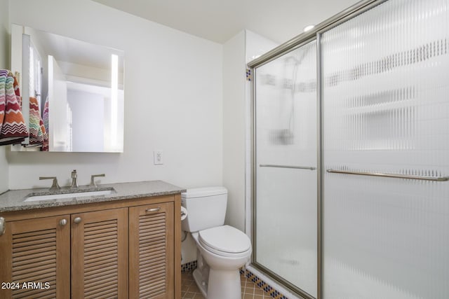 2201 N Central Ave Unit 4E, Phoenix, AZ 85004 - full bath featuring toilet, a shower stall, vanity, and tile patterned floors