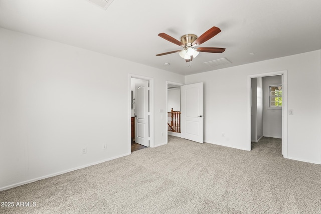 2337 E Fraktur Rd, Phoenix, AZ 85040 - unfurnished bedroom with carpet flooring, baseboards, visible vents, and connected bathroom