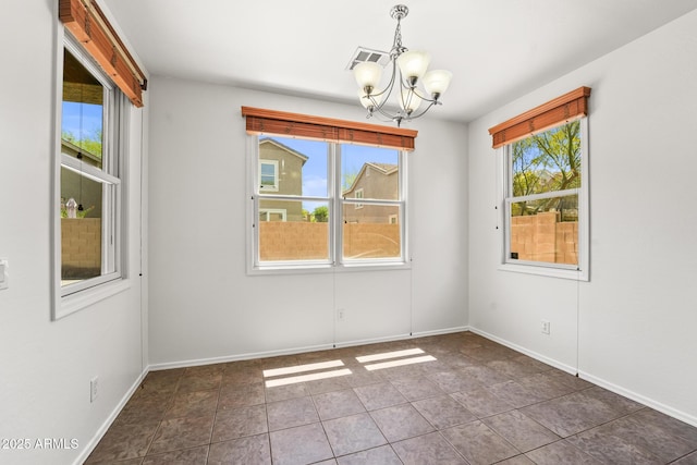 2337 E Fraktur Rd, Phoenix, AZ 85040 - tiled spare room with an inviting chandelier, baseboards, and visible vents