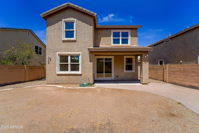 2337 E Fraktur Rd, Phoenix, AZ 85040 - back of property with a fenced backyard, a patio, and stucco siding