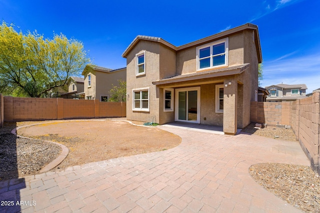 2337 E Fraktur Rd, Phoenix, AZ 85040 - back of house with a fenced backyard, a patio area, and stucco siding