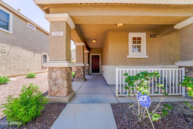 2337 E Fraktur Rd, Phoenix, AZ 85040 - entrance to property featuring a porch, visible vents, and stucco siding