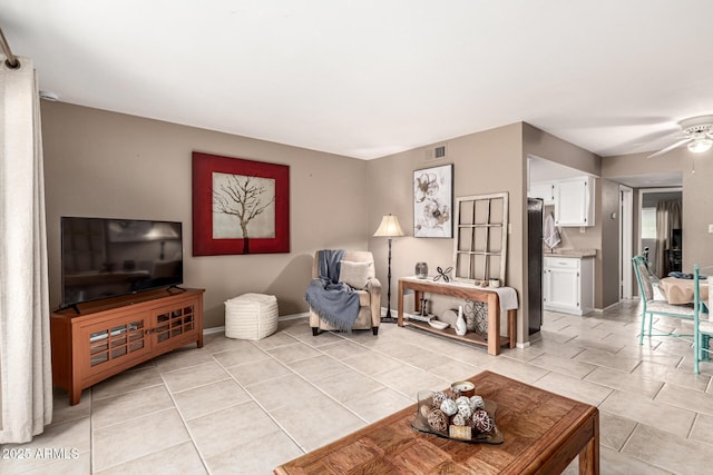 7436 E Chaparral Rd Unit 124B, Scottsdale, AZ 85250 - living room with a ceiling fan, light tile patterned floors, and baseboards
