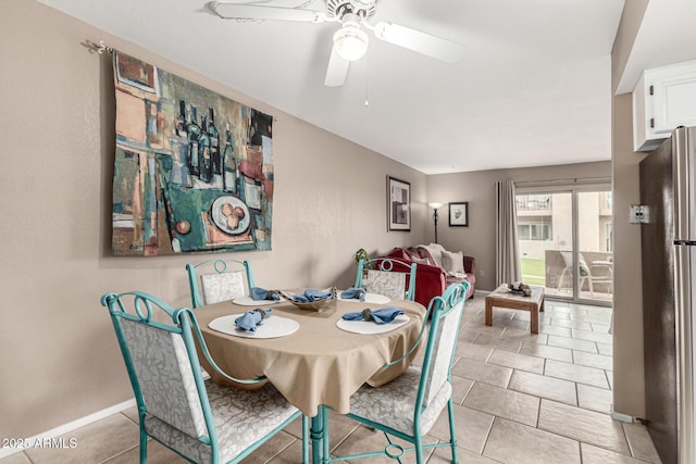 7436 E Chaparral Rd Unit 124B, Scottsdale, AZ 85250 - dining space featuring ceiling fan, baseboards, and light tile patterned floors