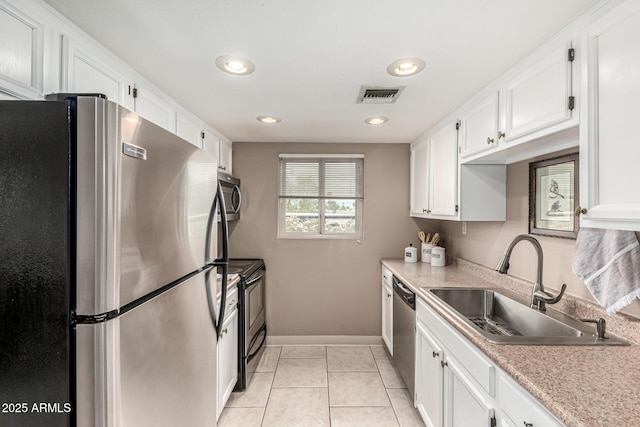 7436 E Chaparral Rd Unit 124B, Scottsdale, AZ 85250 - kitchen featuring stainless steel appliances, a sink, white cabinets, light countertops, and baseboards