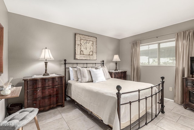 7436 E Chaparral Rd Unit 124B, Scottsdale, AZ 85250 - bedroom with light tile patterned flooring and baseboards