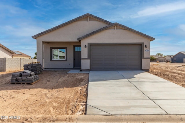 single story home with a garage