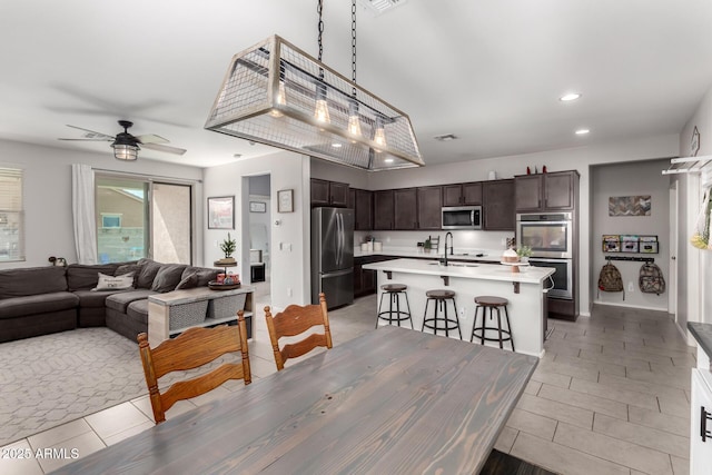 dining room featuring ceiling fan and recessed lighting