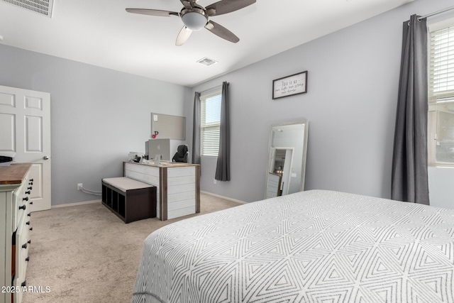 bedroom with light carpet, multiple windows, and visible vents