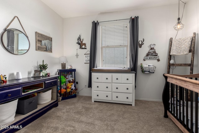 carpeted bedroom with baseboards