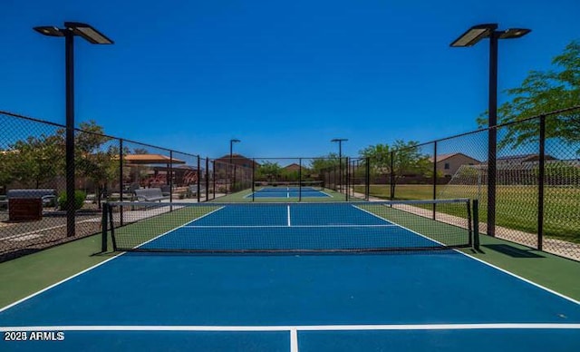 view of sport court featuring community basketball court and fence