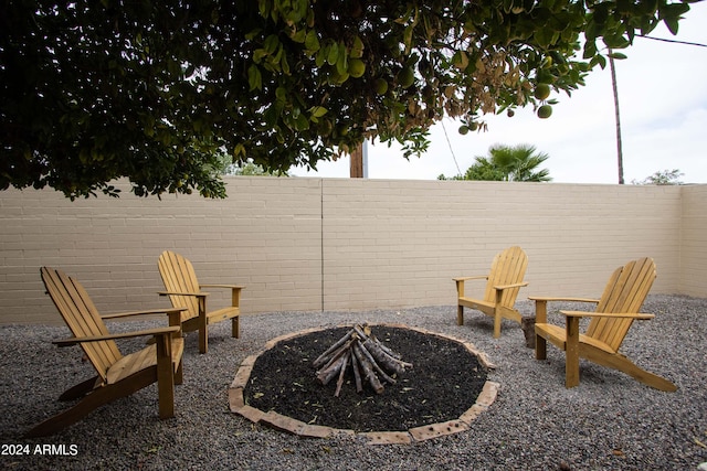 view of patio with a fire pit