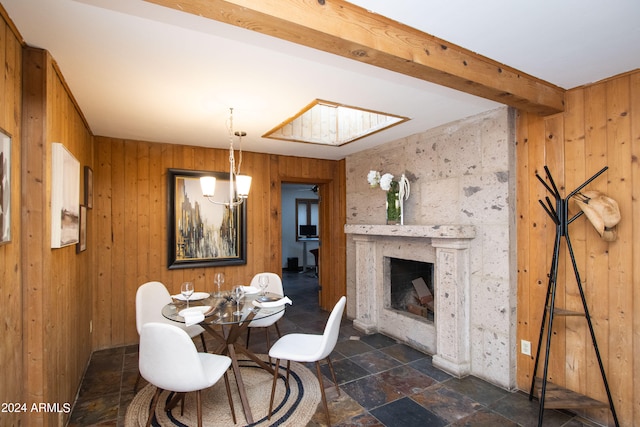 dining room featuring wooden walls