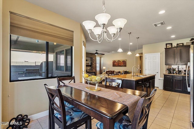dining area featuring light tile patterned floors, visible vents, baseboards, ceiling fan with notable chandelier, and recessed lighting