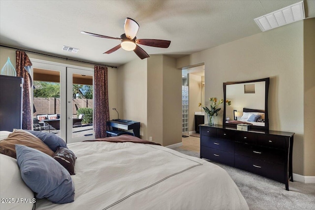bedroom with french doors, light colored carpet, visible vents, and access to exterior