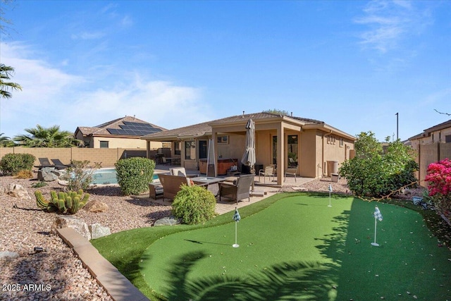 back of house with a patio, a fenced backyard, and stucco siding