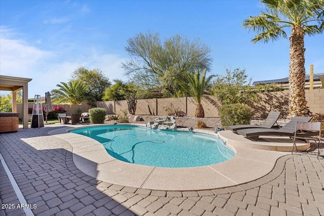 view of pool featuring a patio, a fenced backyard, a fenced in pool, and a hot tub