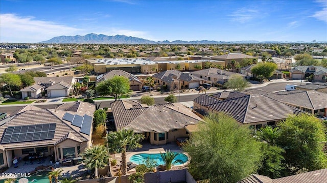 drone / aerial view with a residential view and a mountain view