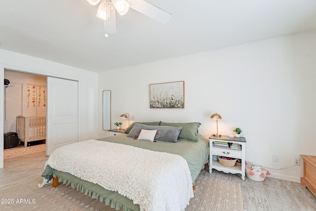 bedroom with a ceiling fan and wood finished floors