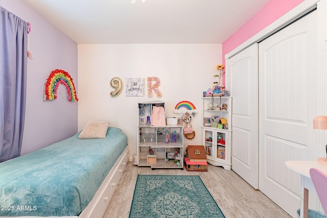 bedroom featuring a closet and wood finished floors