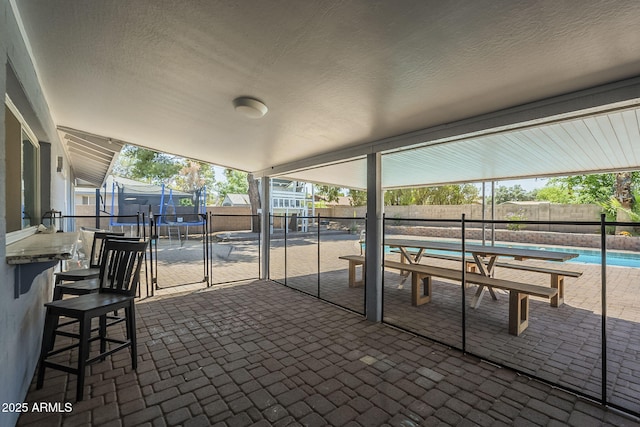 10844 N 37th St, Phoenix, AZ 85028 - view of patio / terrace with a trampoline, a fenced backyard, and a fenced in pool