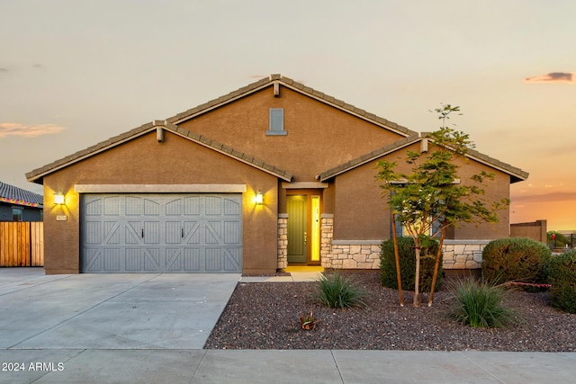 view of front of home with a garage